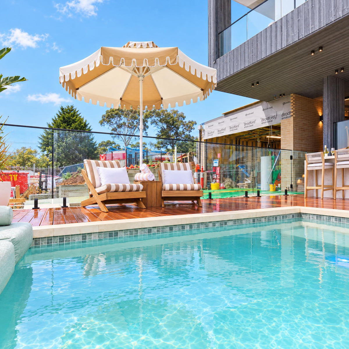 Desert Sand double-tier umbrella by Retro Umbrella Co at Adam & Jolene's pool, Pool & Terrace Week winner on The Block 2026