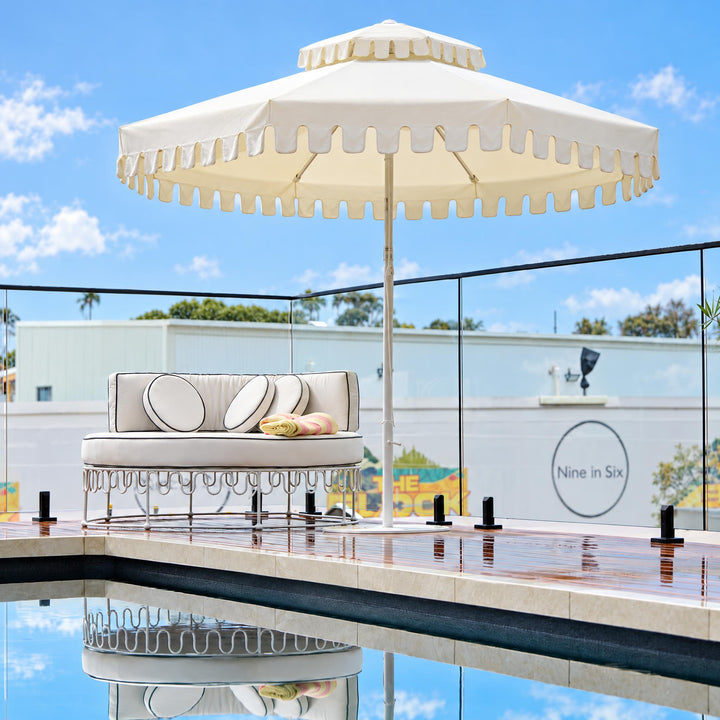 Ivory Mist umbrella by Retro Umbrella Co at Lisa & Rosco's pool, The Block 2026